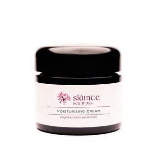 Jar of Slainte Sea Moss moisturizing cream on a white background