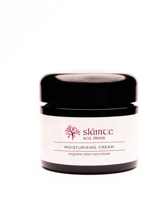 Jar of Slainte Sea Moss moisturizing cream on a white background