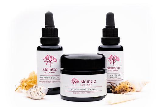 Sláinte skincare products including serum bottles and a cream jar on a white background
