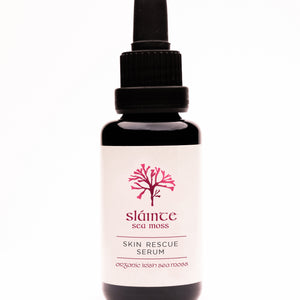 A bottle of Skin Rescue Serum by Sláinte, with a dropper, on a white background.